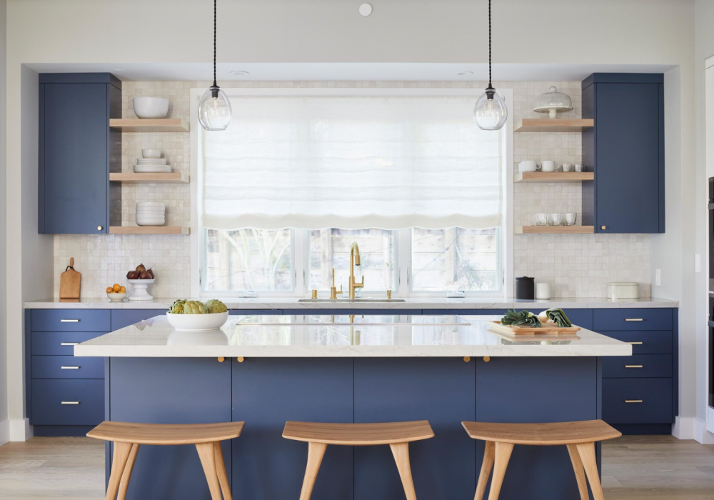 Coddington_design_Woodside_navy-kitchen-cabinets-white-oak-backsplash-bright-island-pendants