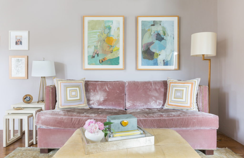Coddington-bay-area-pink-sofa-neutral-palette-abstract-art-area-rug-side-tables-floor-lamp