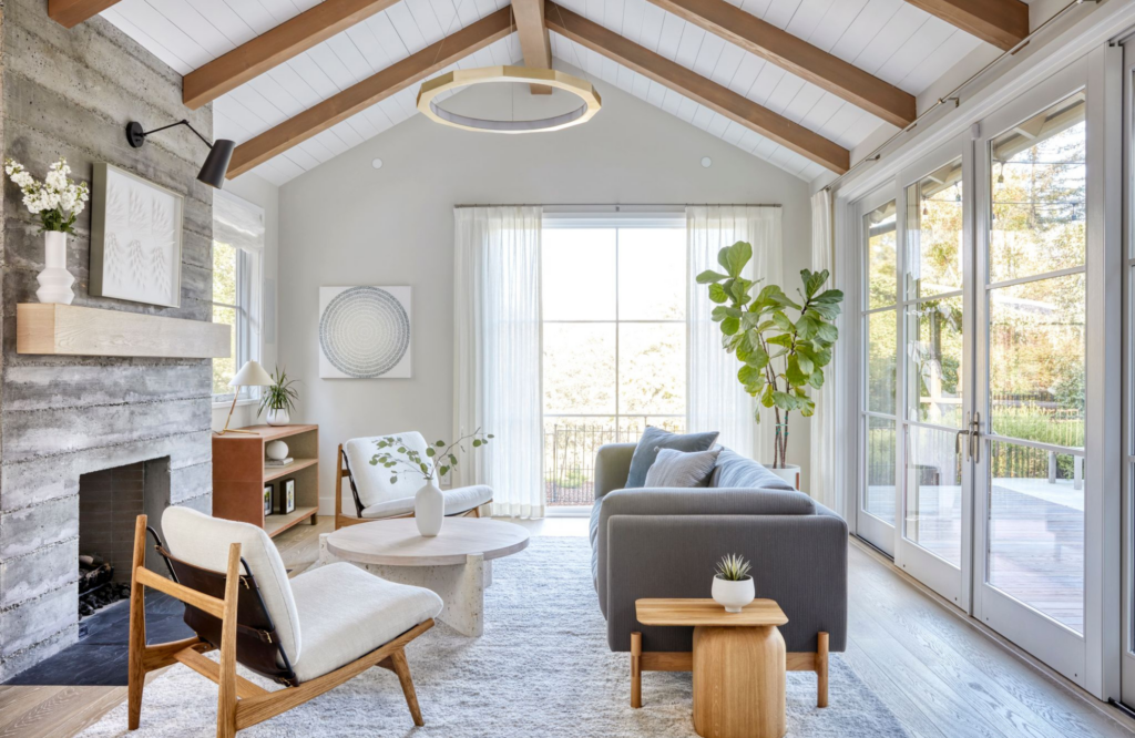 Coddington-bay-area-white-fresh-transitional-art-accent-white-oak-chair-fireplace-living-room-wood-beams